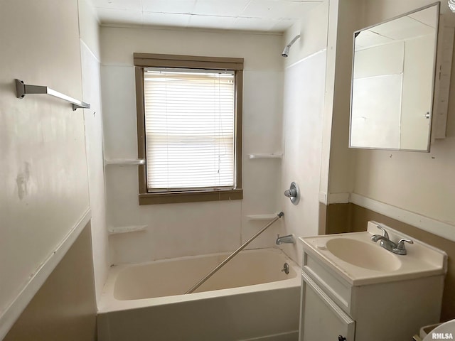bathroom featuring shower / washtub combination and vanity with extensive cabinet space