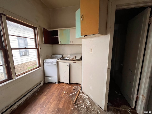 clothes washing area with dark hardwood / wood-style flooring, cabinets, and washing machine and clothes dryer