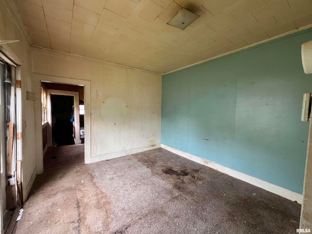 spare room featuring crown molding