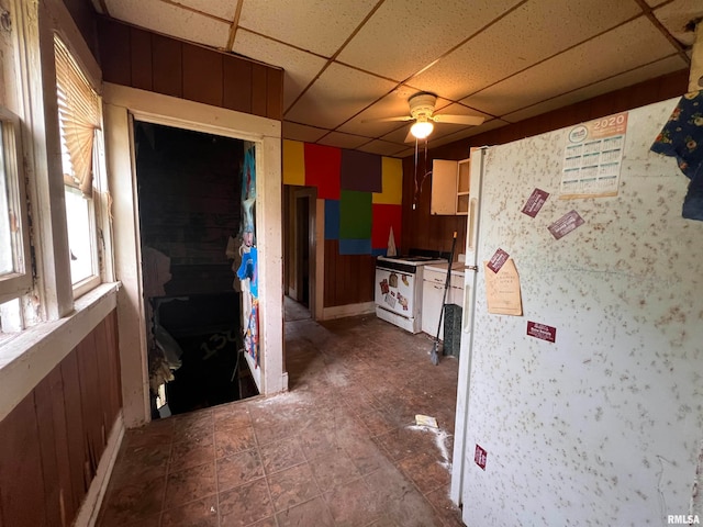 kitchen with white appliances, a paneled ceiling, and ceiling fan