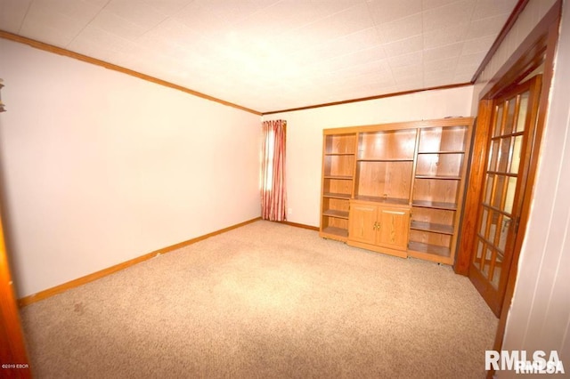 unfurnished bedroom with light carpet and crown molding