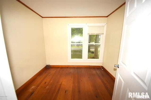 unfurnished room featuring crown molding and dark hardwood / wood-style flooring