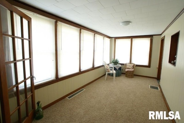 unfurnished sunroom with a wealth of natural light