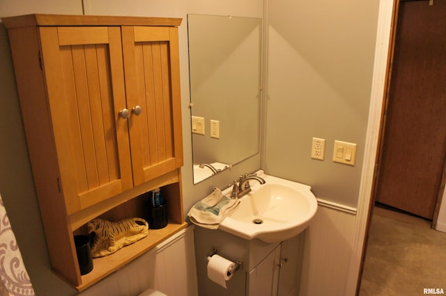 bathroom featuring tile floors and vanity