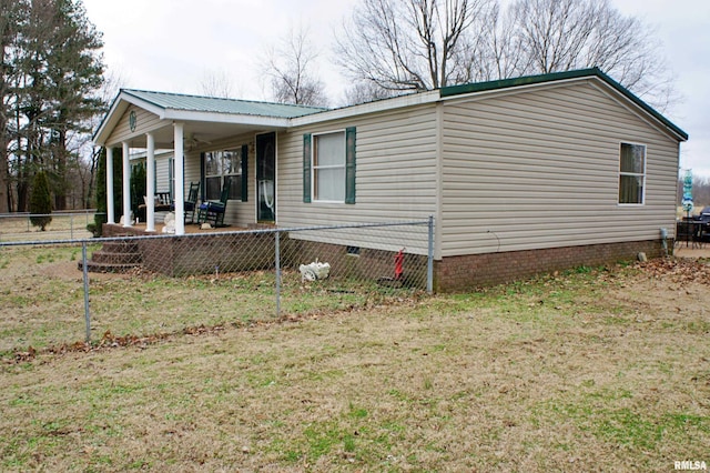 view of home's exterior with a yard