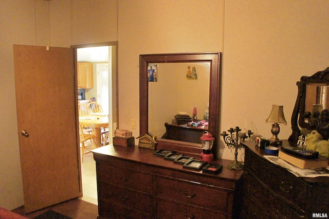 bedroom with dark tile floors