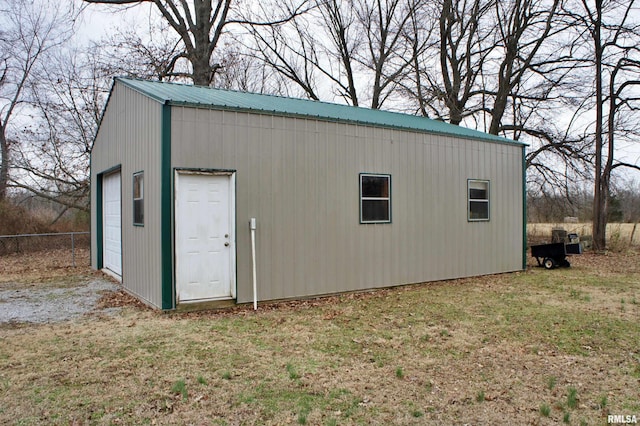 view of outdoor structure with a lawn