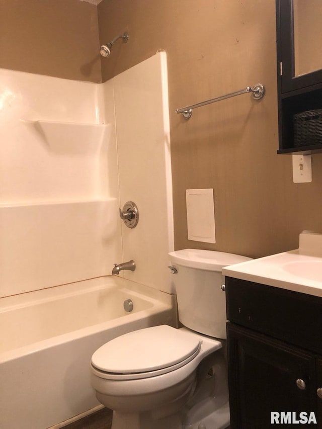 full bathroom featuring vanity, toilet, and  shower combination