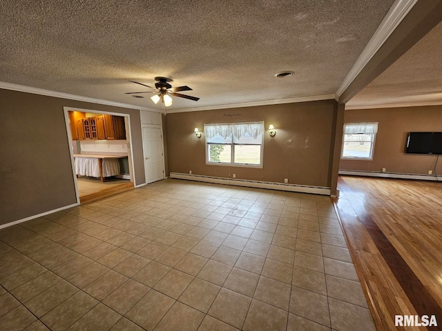 unfurnished living room featuring crown molding, a baseboard radiator, and plenty of natural light