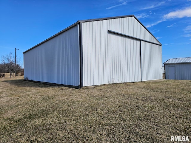 view of outdoor structure with a lawn