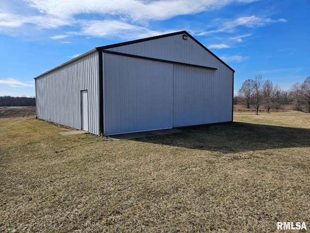 view of outbuilding with a lawn