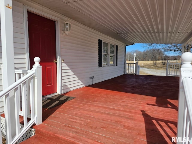 wooden terrace featuring covered porch