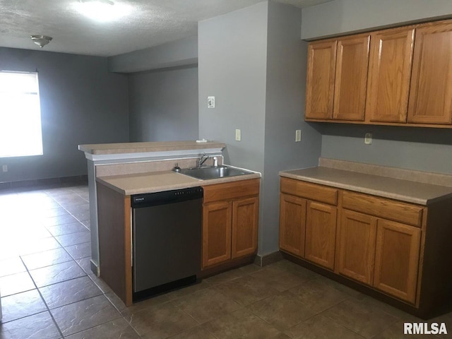 kitchen featuring dishwasher, sink, and kitchen peninsula
