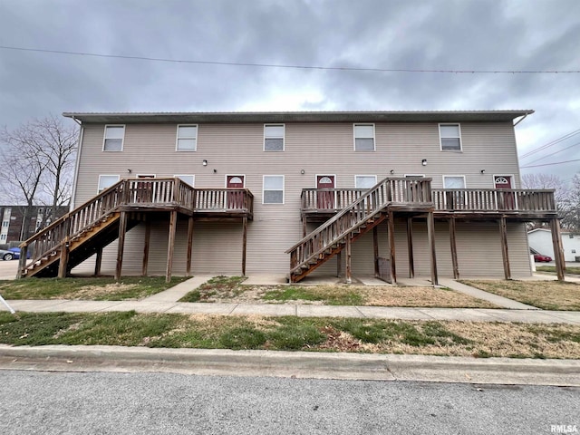 rear view of house featuring a deck