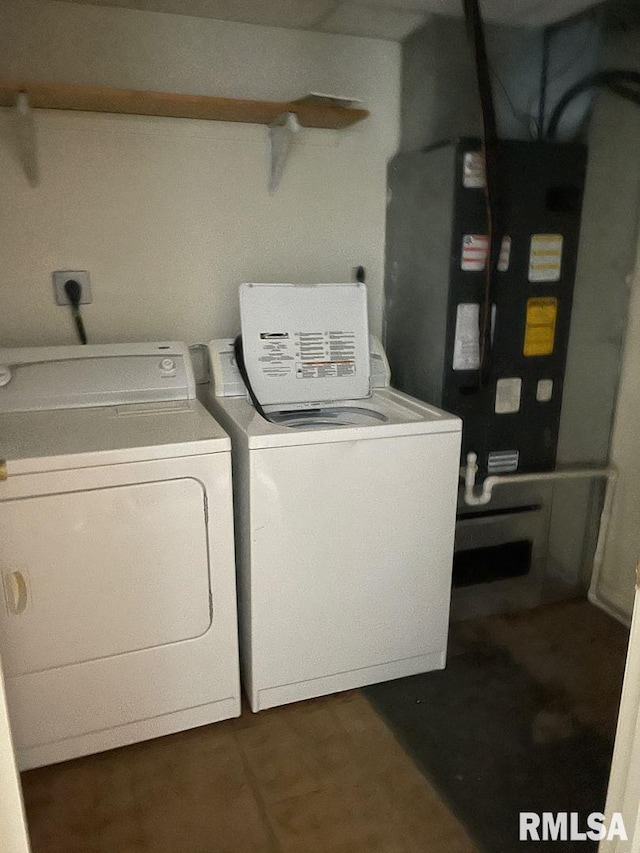 laundry room featuring washing machine and clothes dryer