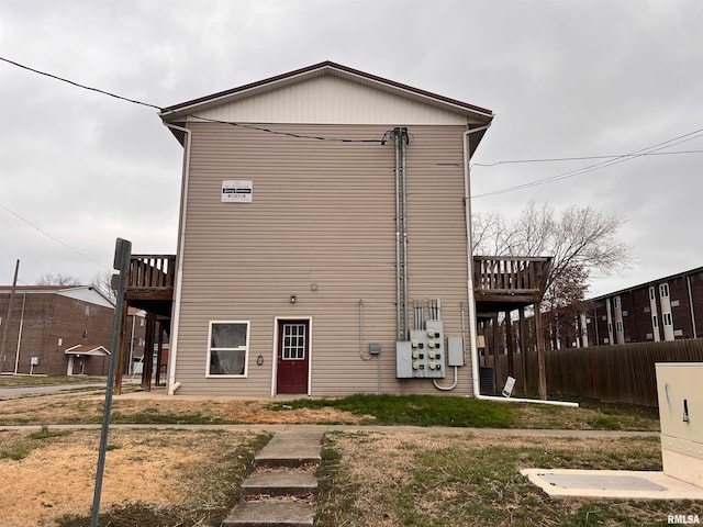 view of front of house with a front lawn and a deck