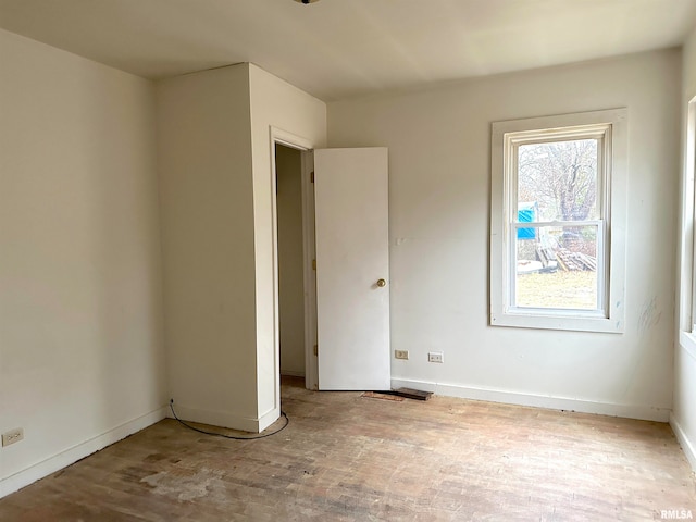 empty room with light hardwood / wood-style floors