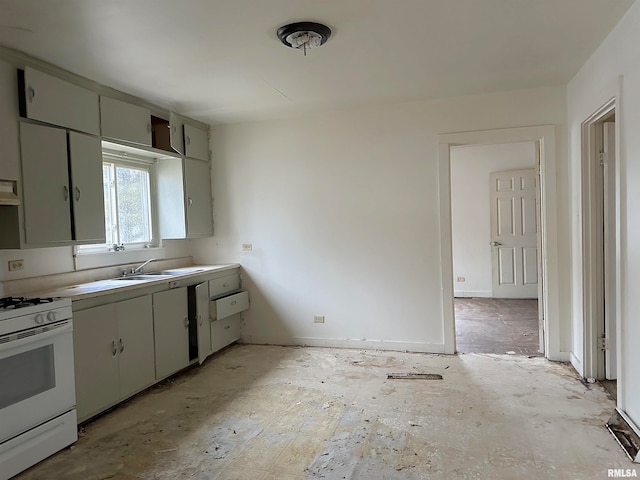 kitchen featuring sink, gray cabinets, and white range with gas stovetop