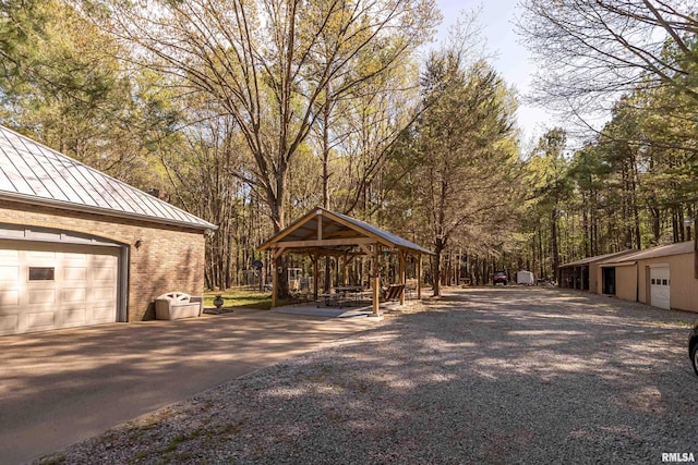 exterior space with an outbuilding and a garage