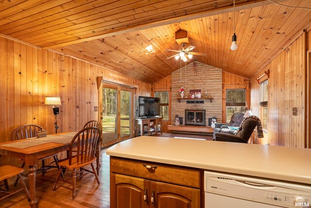 kitchen featuring wooden ceiling, lofted ceiling, a fireplace, and hardwood / wood-style floors