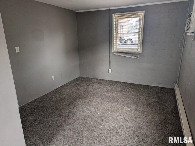 carpeted empty room with baseboard heating