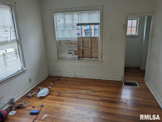 empty room with dark hardwood / wood-style floors