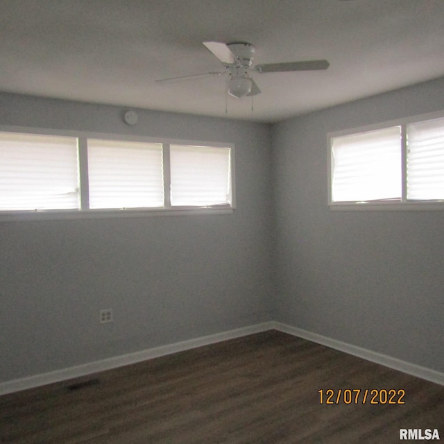 empty room featuring dark hardwood / wood-style floors and ceiling fan