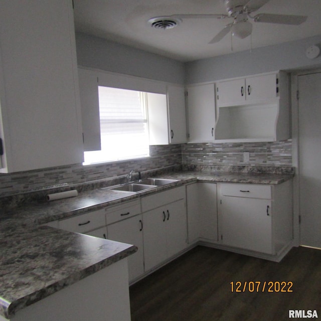 kitchen featuring white cabinets, backsplash, ceiling fan, and sink