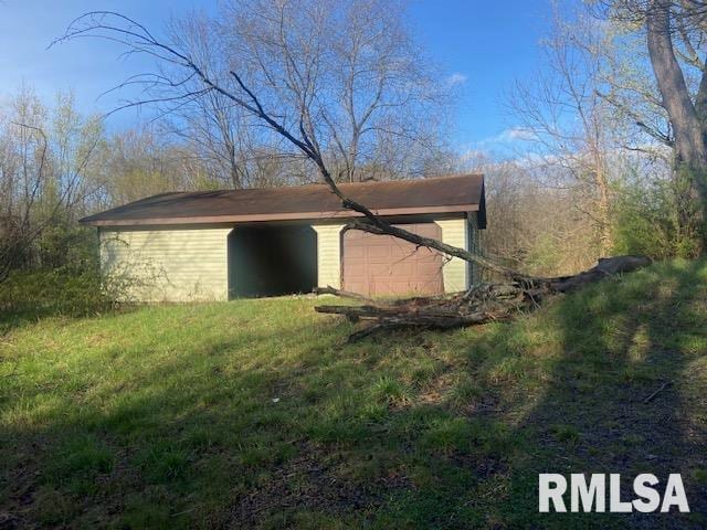 view of outdoor structure with a garage