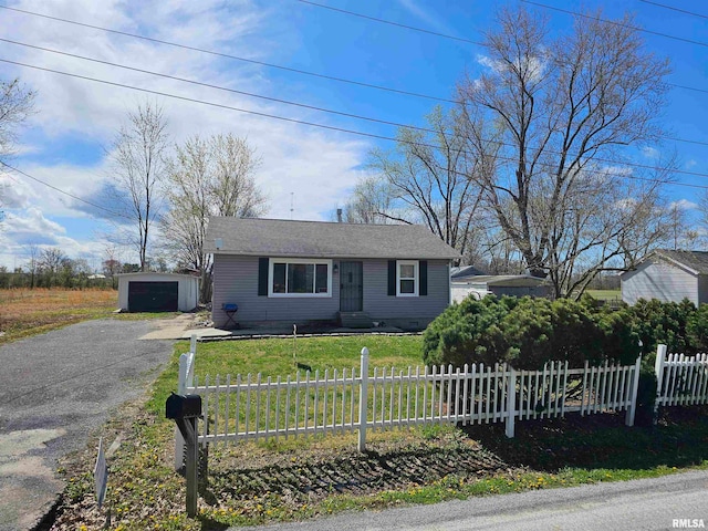 view of front of house with a front lawn and a garage