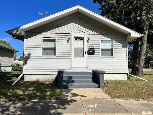 view of front of home with a front yard