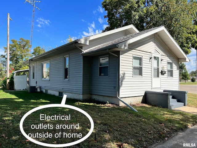 view of property exterior featuring a yard and central air condition unit