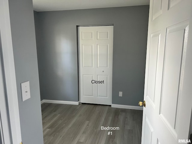 empty room featuring dark hardwood / wood-style flooring