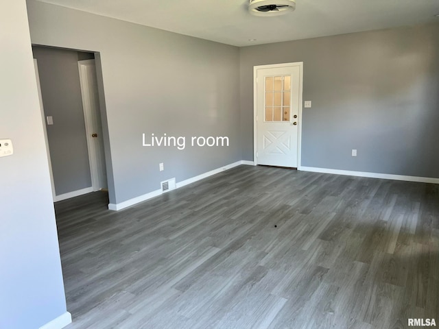 unfurnished room with dark hardwood / wood-style floors