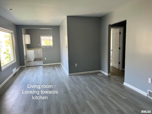 unfurnished living room featuring hardwood / wood-style floors