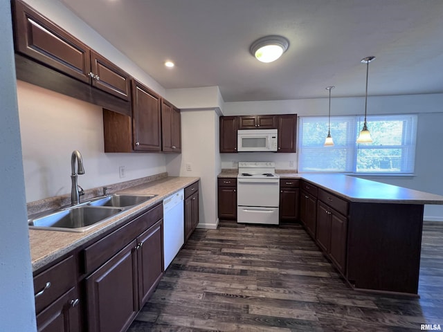 kitchen featuring dark brown cabinetry, a peninsula, white appliances, dark wood-type flooring, and a sink