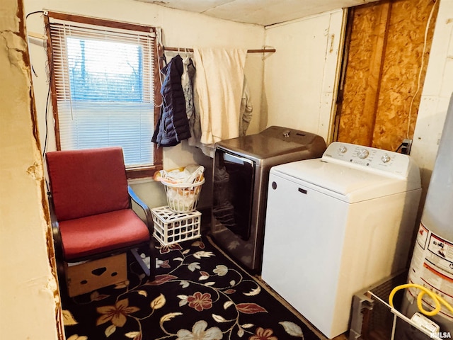 clothes washing area featuring laundry area and washing machine and clothes dryer