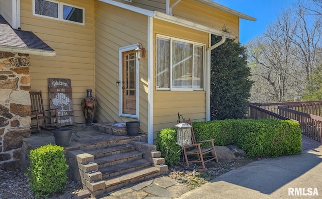 entrance to property featuring a deck