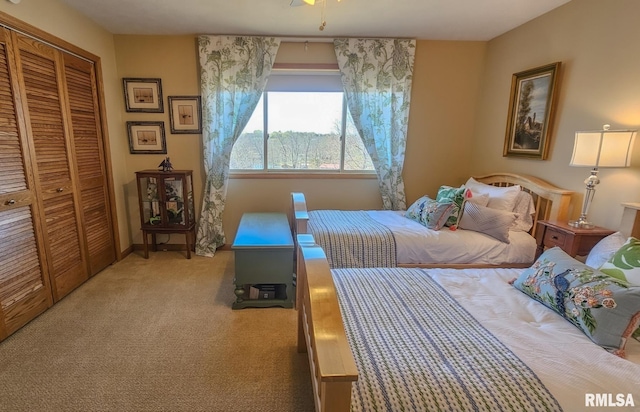 carpeted bedroom with a closet