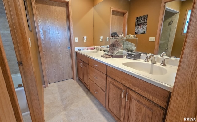 bathroom with double sink, large vanity, and tile floors