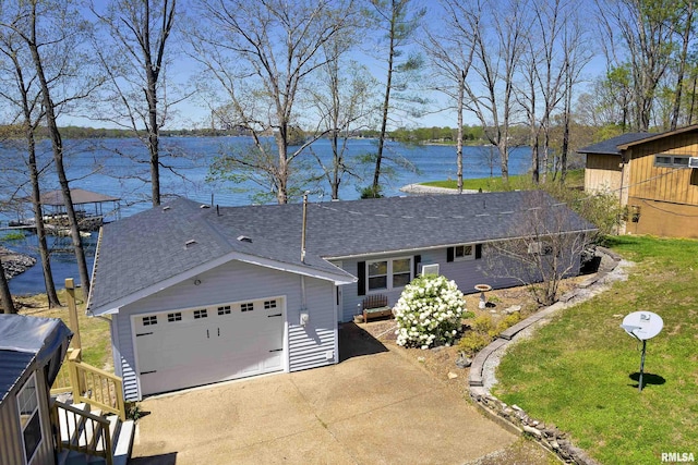 view of front of property with a water view and a front lawn