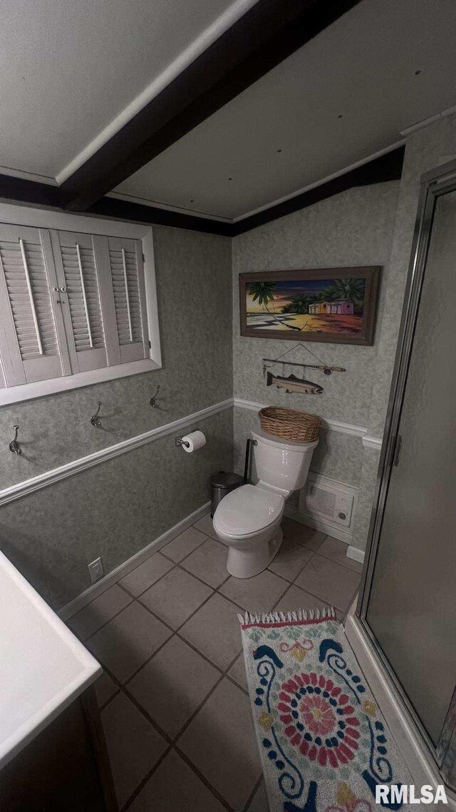 bathroom with tile patterned flooring, vanity, toilet, and crown molding