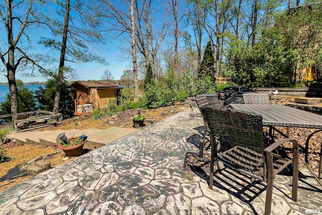 view of patio with a storage unit