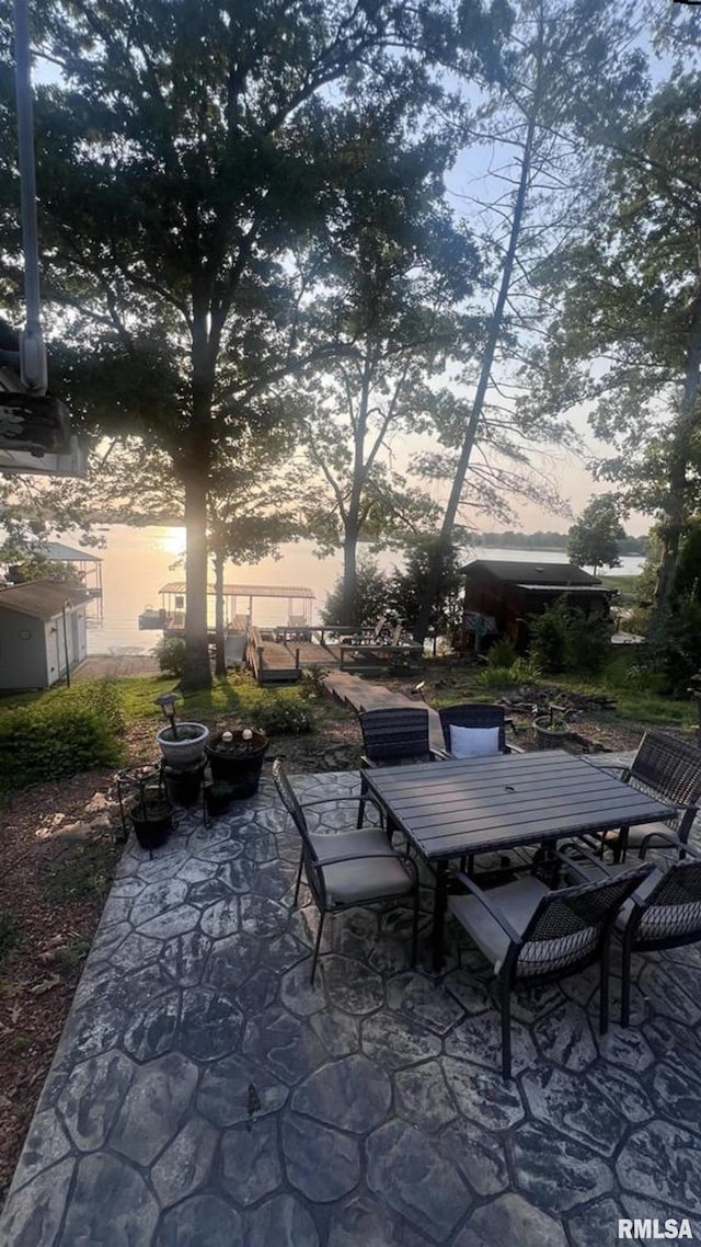 view of patio terrace at dusk