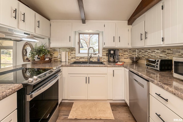 kitchen featuring white cabinets, sink, beamed ceiling, dark hardwood / wood-style flooring, and stainless steel appliances