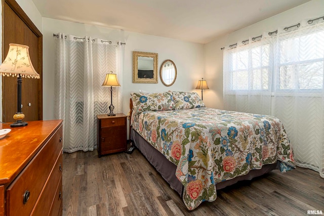 bedroom featuring dark wood-type flooring