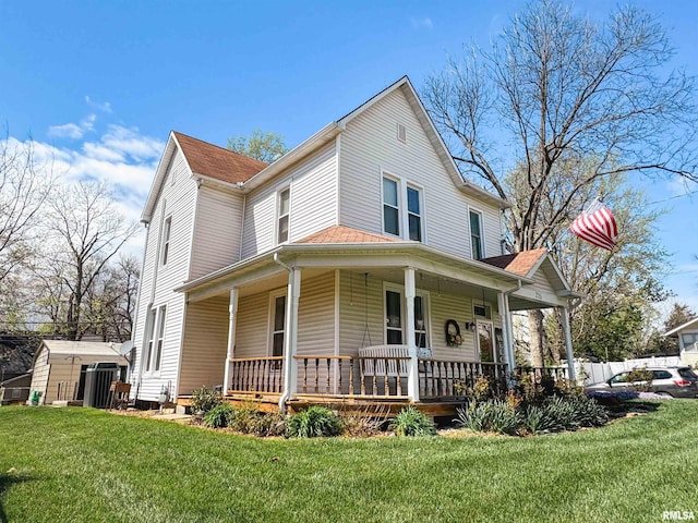 view of front of home with a front yard and a porch