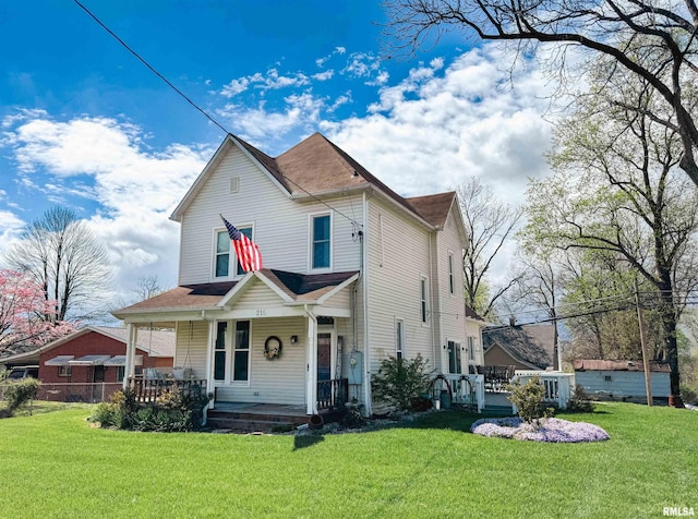 view of front of property featuring a front lawn and covered porch