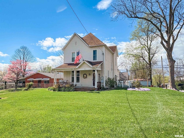 view of front of property with a porch and a front yard