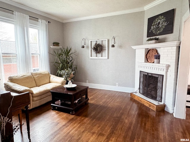 living room with a brick fireplace, crown molding, dark hardwood / wood-style flooring, and a textured ceiling